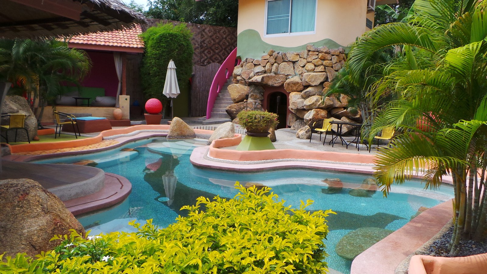the colourful pool at Pandora Lifestyle Hotel